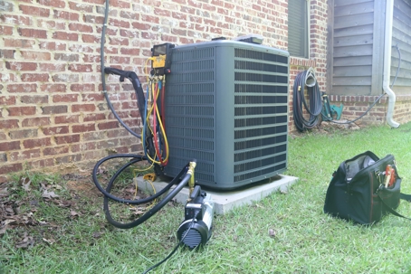 Tools next to an HVAC unit