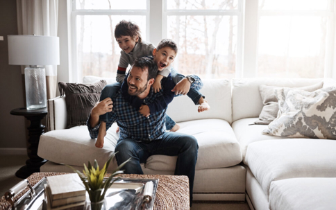 Father with two sons on a sofa